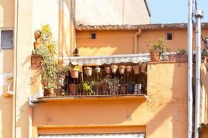 House with terrace and flowerpots photo