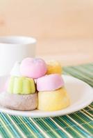 Colorful dessert mochi on white plate photo