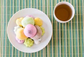 Colorful dessert mochi on white plate photo