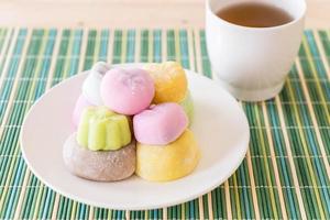 Colorful dessert mochi on white plate photo