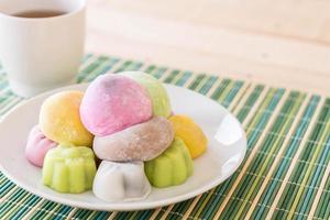 Colorful dessert mochi on white plate photo