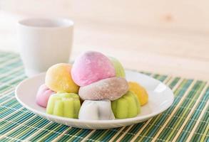 Colorful dessert mochi on white plate photo