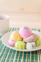 Colorful dessert mochi on white plate photo