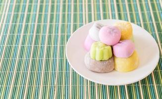 Colorful dessert mochi on white plate photo