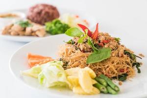 Stir-fried noodle with pork and basil photo