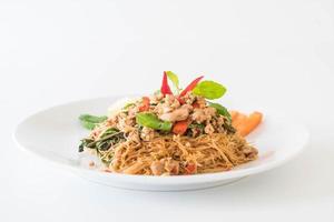 Stir-fried noodle with pork and basil photo