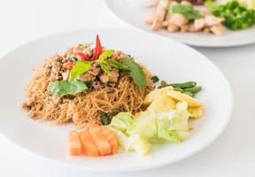 Stir-fried noodle with pork and basil photo