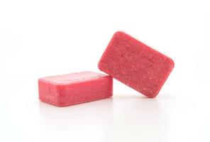 Pink soap on white background photo