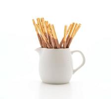 Biscuit stick with almond-flavored on white background photo