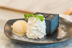Charcoal toast with ice cream and whip cream photo