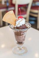 Chocolate sundae ice cream in cafe photo