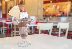 Chocolate sundae ice cream in cafe photo