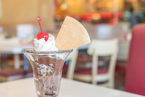 Chocolate sundae ice cream in cafe photo