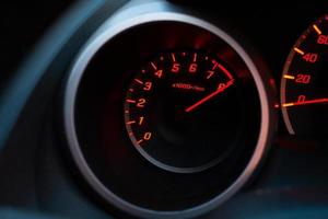 Close up of car speedometer with the needle pointing at  8 krpm photo