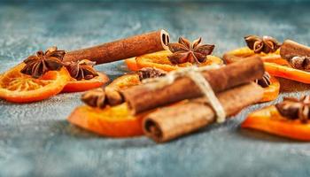 Slices of dried oranges or tangerines with anise and cinnamon photo