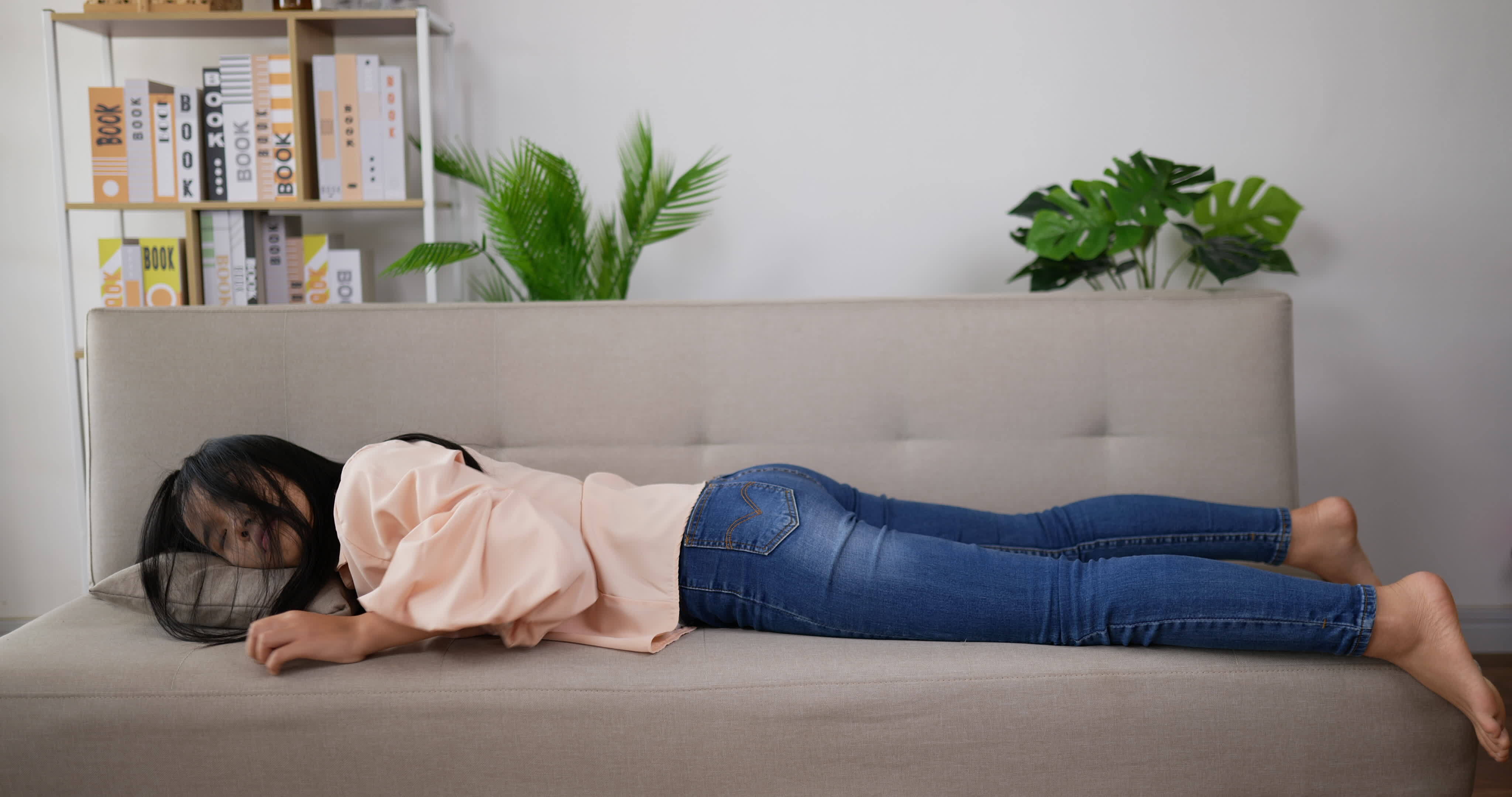 Woman Laying Down on A Couch to Sleep 3044404 Stock Video at Vecteezy