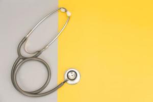 Stethoscope for doctor and copy space on color background photo