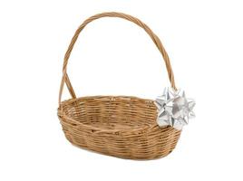 Empty wicker basket with ribbon isolated on white and clipping path photo