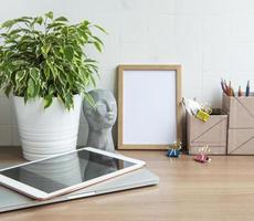 Laptop with office supplies on the table. photo