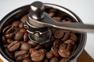 Coffee bean roasted in wooden grinder. photo