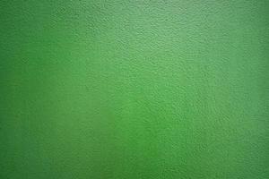 Muro de hormigón de cemento de color verde para la textura del fondo. foto