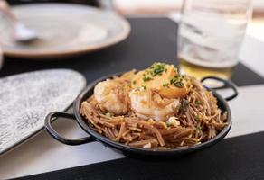 small spring noodles with large prawns and piquillo pepper sauce photo