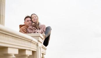 Young loving couple embracing each other outdoors in the park photo