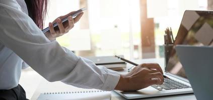 Business women hand are uses a smartphone photo