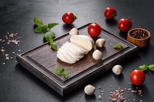 Tasty fresh mozzarella cheese for making caprese salad photo