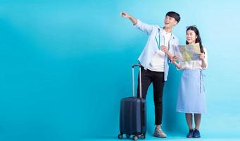 Asian couple are traveling together photo