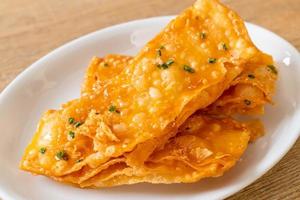 Crispy roti with sugar on plate photo