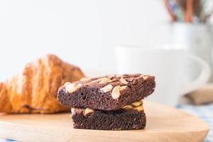 Croissant and brownies on table photo