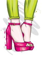 Female feet in stylish high-heeled shoes