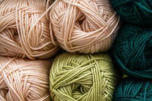 Many balls of wool yarn for knitting. photo