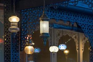 background with Oriental lights in the background of a wooden wall. photo