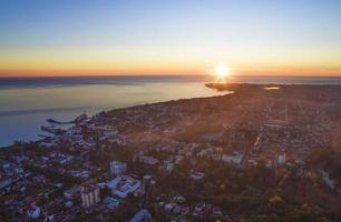 Top view of the evening city by the sea. photo