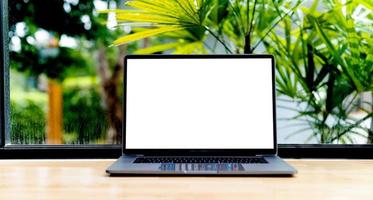 Laptop with blank screen on desk, in office, empty space. concept photo