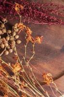 wooden background with dried flowers photo