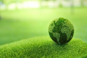 Close up earth on green background photo