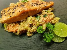 Norwegian fjord salmon with black sesame seeds on couscous photo