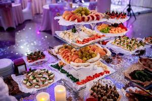 Attractive set of canapes with vegetables, cheese, fruits photo