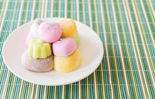 Colorful dessert mochi on white plate photo