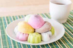 Colorful dessert mochi on white plate photo