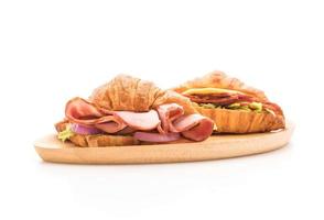 Croissant sandwich ham on white background photo