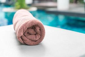 Pool towel on chair decoration around swimming pool photo