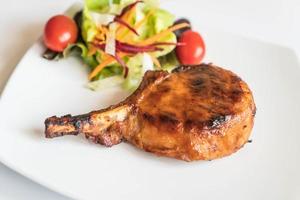 Pork chop steak on the table photo