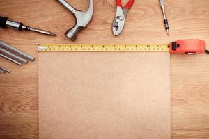 Working tools on wooden background. top view photo