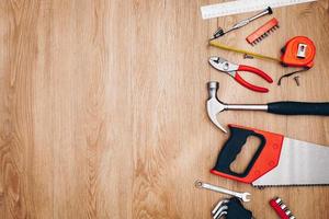 Working tools on wooden background. top view photo