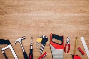 Working tools on wooden background. top view photo