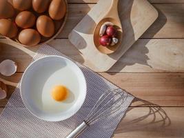 Eggs lay on wooden trays and have broken eggs. photo